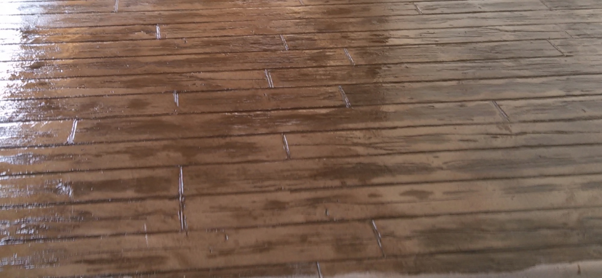 A wood-look stamped concrete finish by T. Archer Concrete