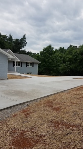 A concrete driveway finished alongside a Tennessee home