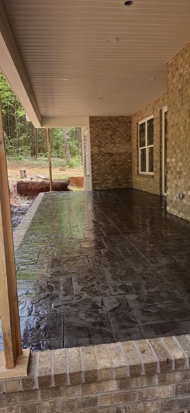 A stamped concrete porch floor with a rich finish