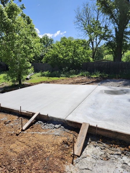 A finished concrete slab in a Tennessee yard