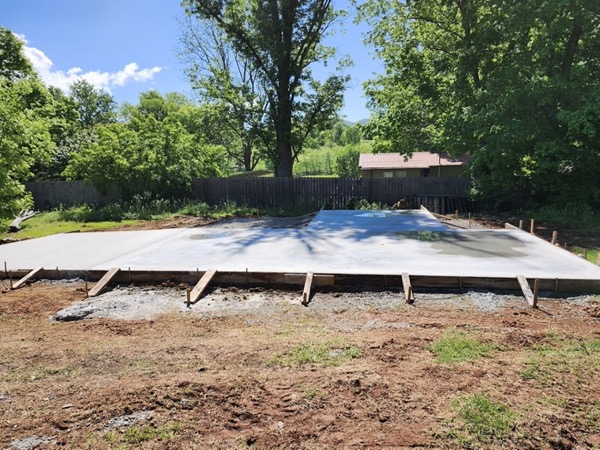 A freshly poured slab covered and left to cure