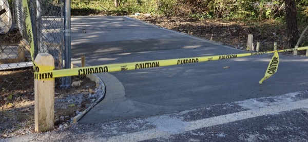 A new concrete driveway taped off while it cures