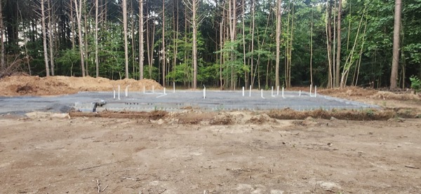 Footings and formwork set out on a wooded building site