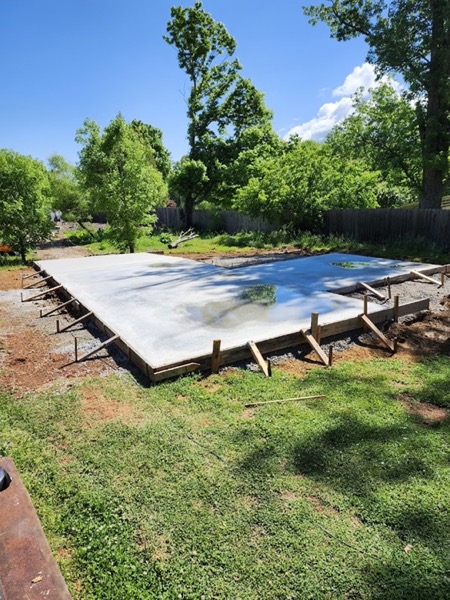 A freshly poured slab with water standing on the surface
