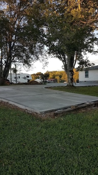 A new concrete driveway beside a Tennessee home