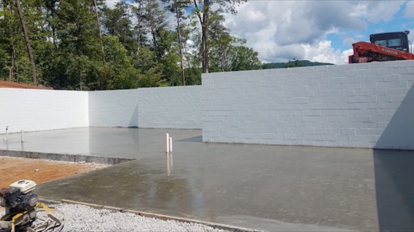 A smooth concrete wall and slab, freshly finished