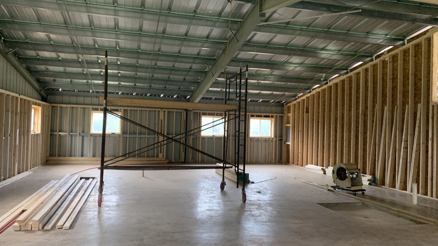 A finished shop slab inside a pole barn, poured by T. Archer Concrete